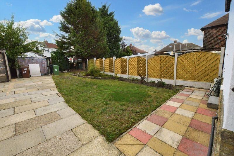 A well-maintained garden area featuring a neat ...