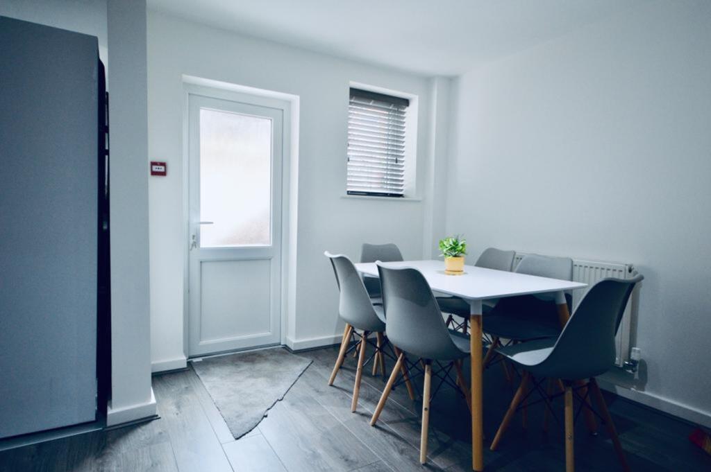 A bright and modern kitchenette with ample spac...