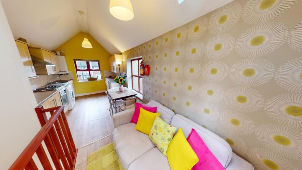 A bright and inviting living room with stylish ...