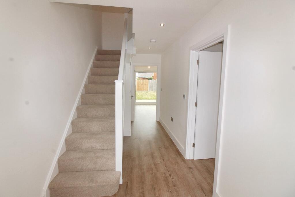 Hallway and stairs to first floor 