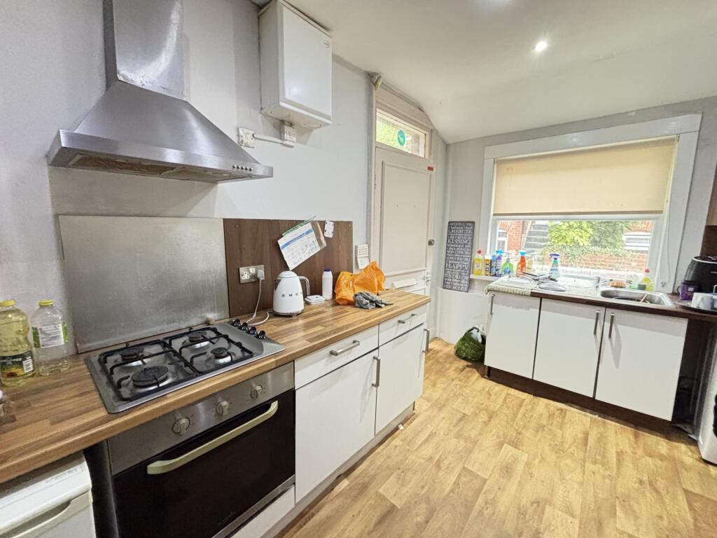 Bright and clean kitchen featuring modern appli...