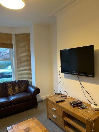 A comfortable and well-maintained living room f...