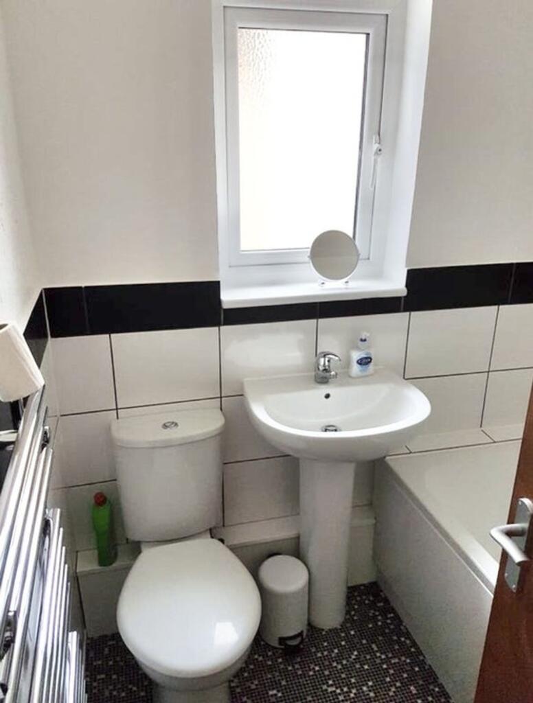 A modern bathroom featuring a sleek design with...