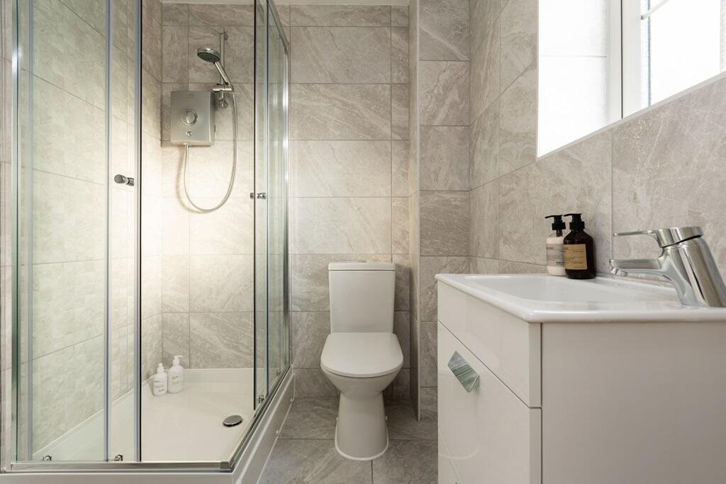 An en suite shower room away from the family