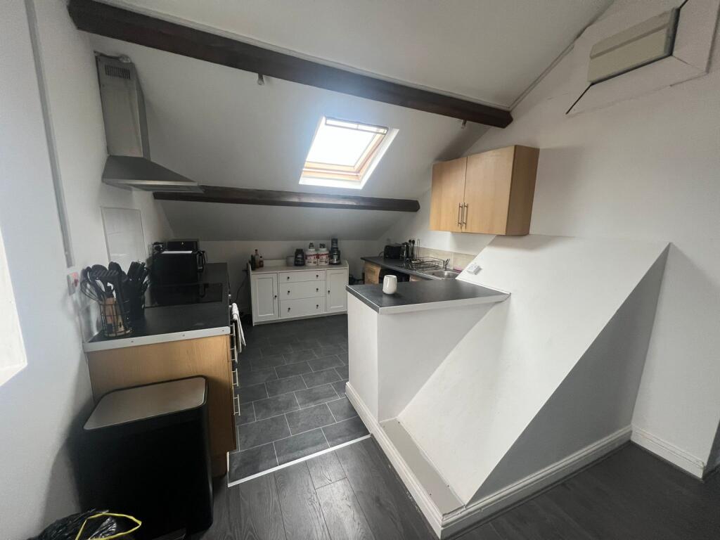 A bright and functional kitchen area with ample...