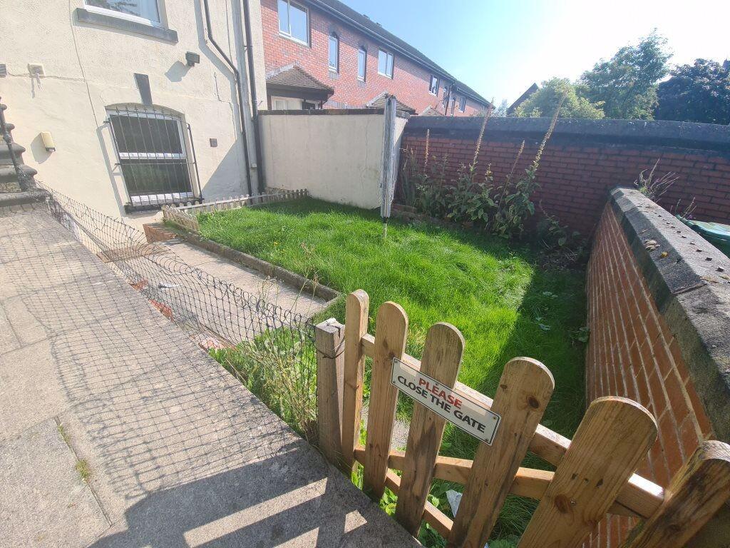 Bright and inviting garden space featuring a we...