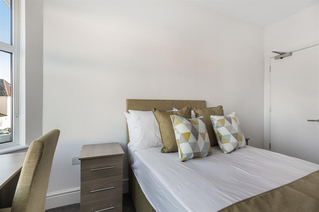 Bright and inviting double bedroom featuring a ...