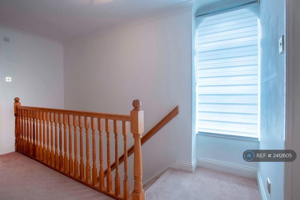 Upstairs Landing With Arched Window