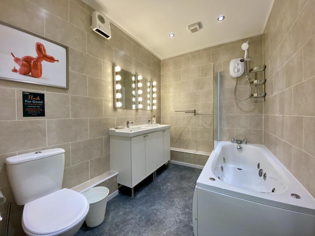 A modern, well-maintained bathroom featuring a ...