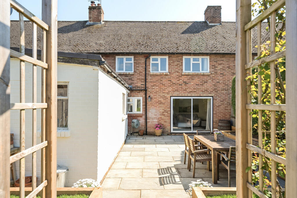 Rear terrace and storage room / potential home office/playroom/dining room/bedroom 4