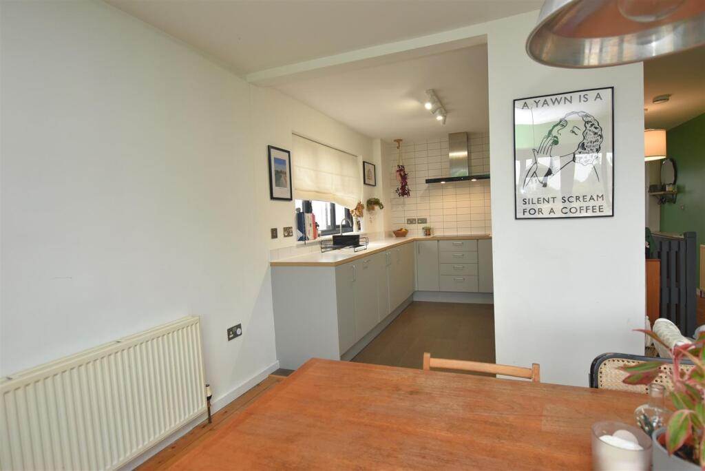 Dining Area to Kitchen