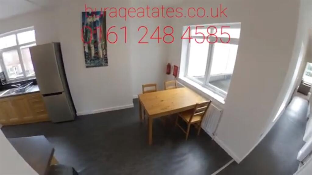 Bright, modern kitchen with large windows, simp...