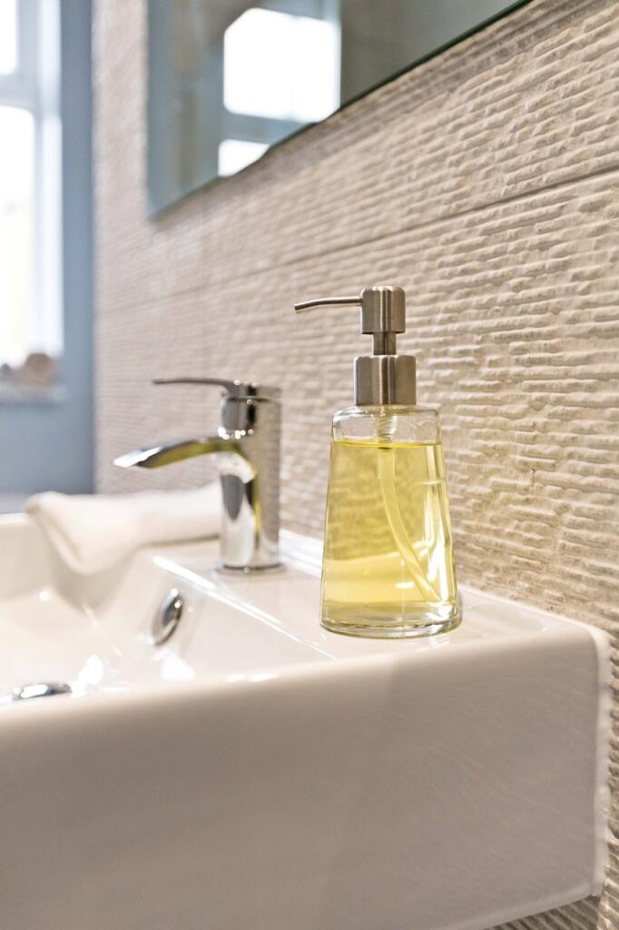 Close-up of a modern sink with chrome faucet an...