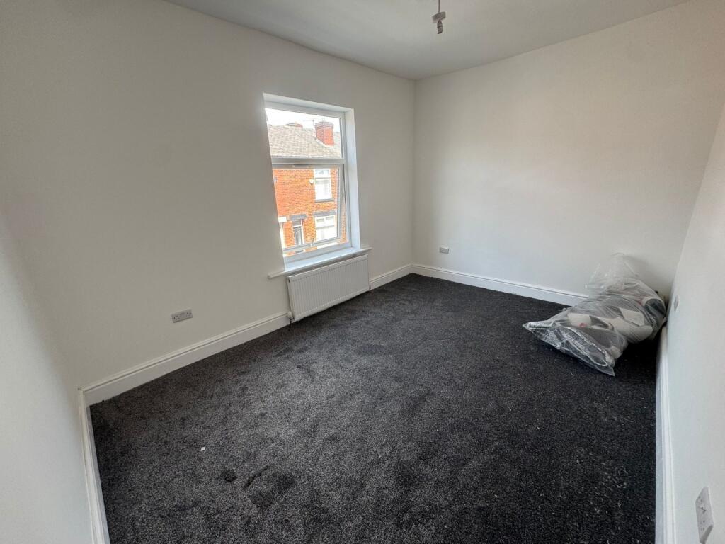 Bright and freshly painted double bedroom featu...
