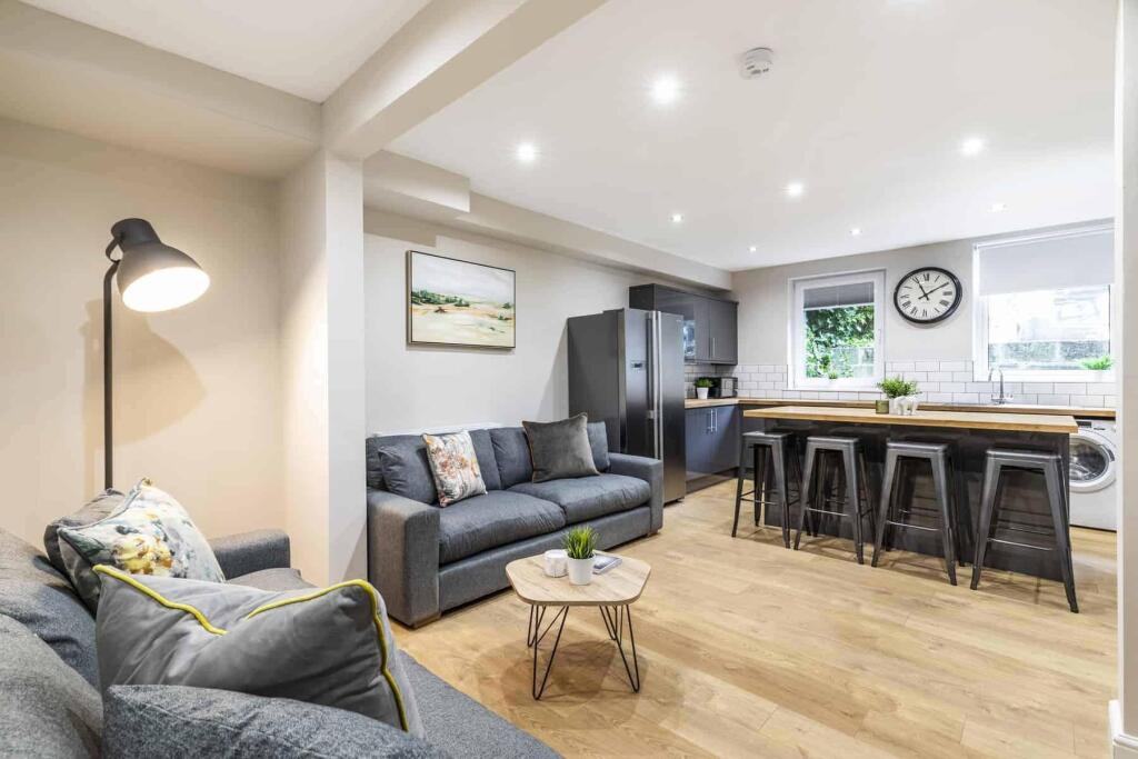 A modern and spacious living room filled with n...