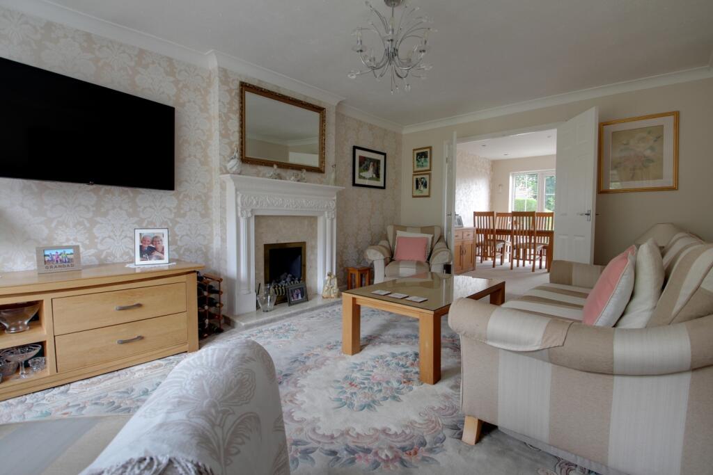 Living room showing the dining area in the backgro