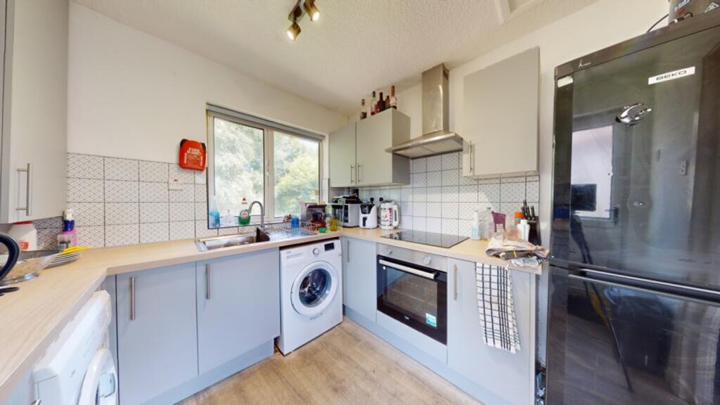 A bright and modern kitchen featuring essential...