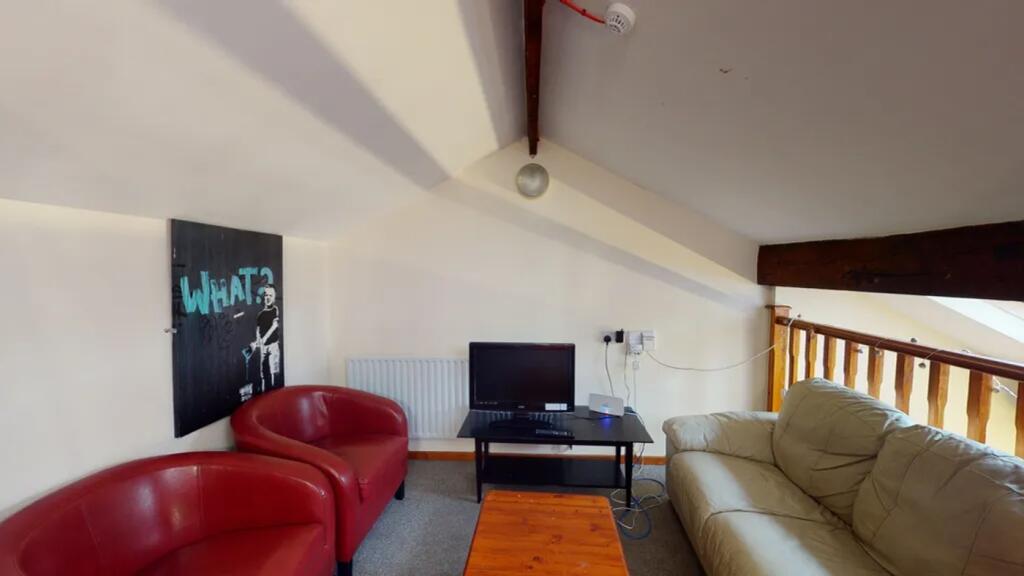 A cozy and inviting living room featuring comfo...