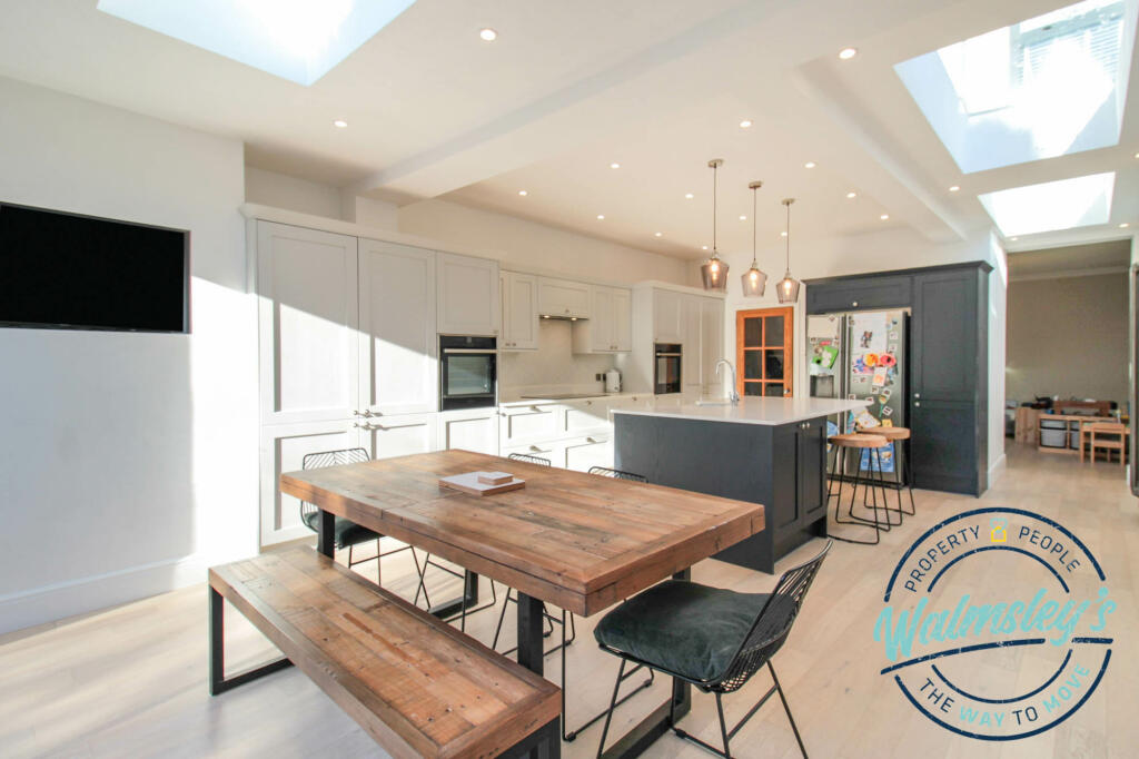 Kitchen dining with family room beyond