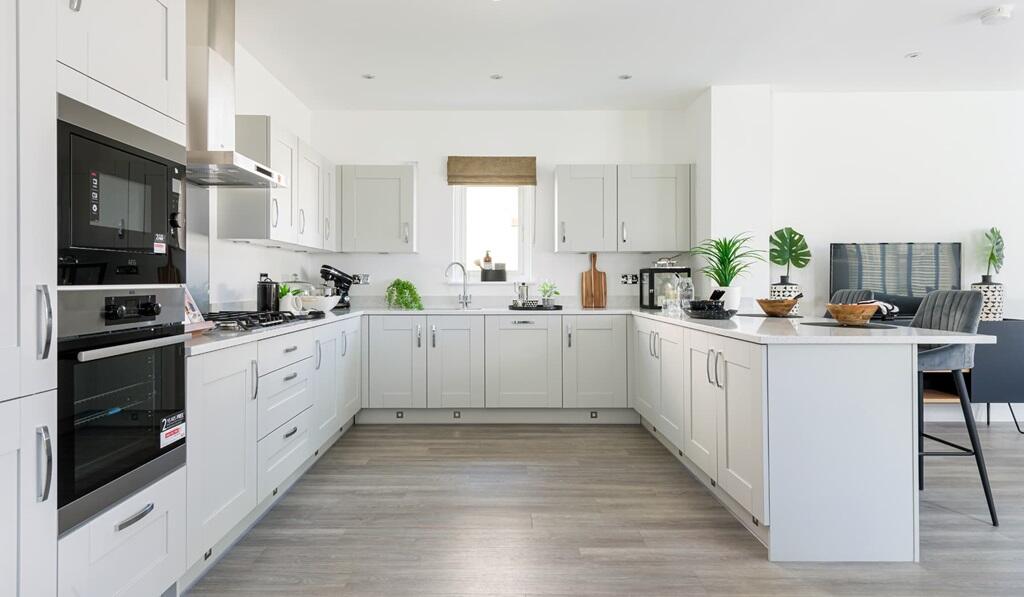 The kitchen offers plenty of space for storage