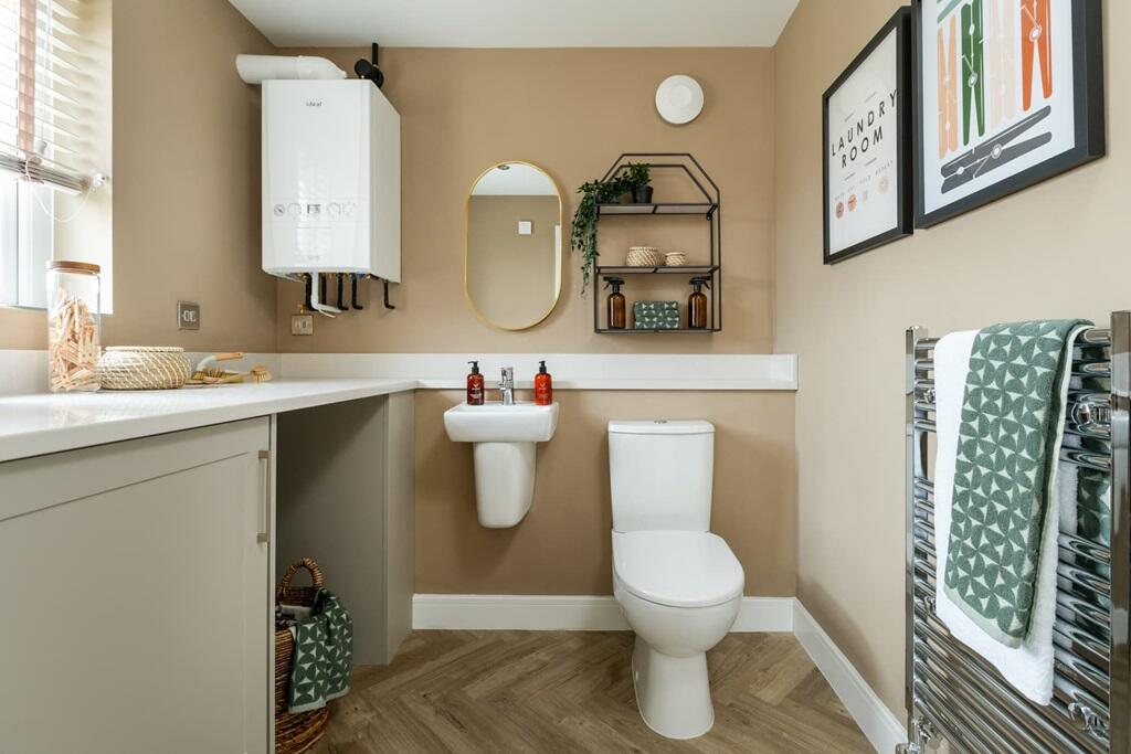 A combined cloakroom and utility adds convenience