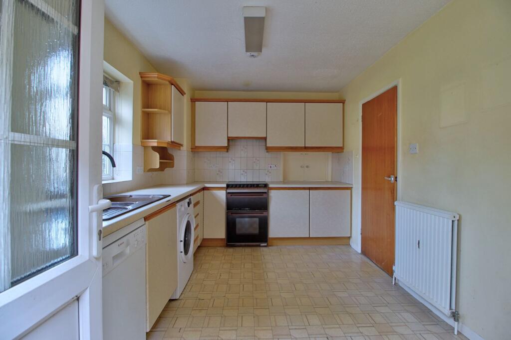 Back door opens to kitchen