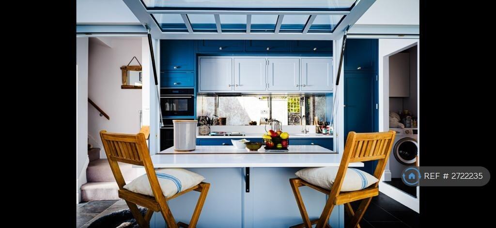 View Into The Kitchen With Mirrored Splashback.
