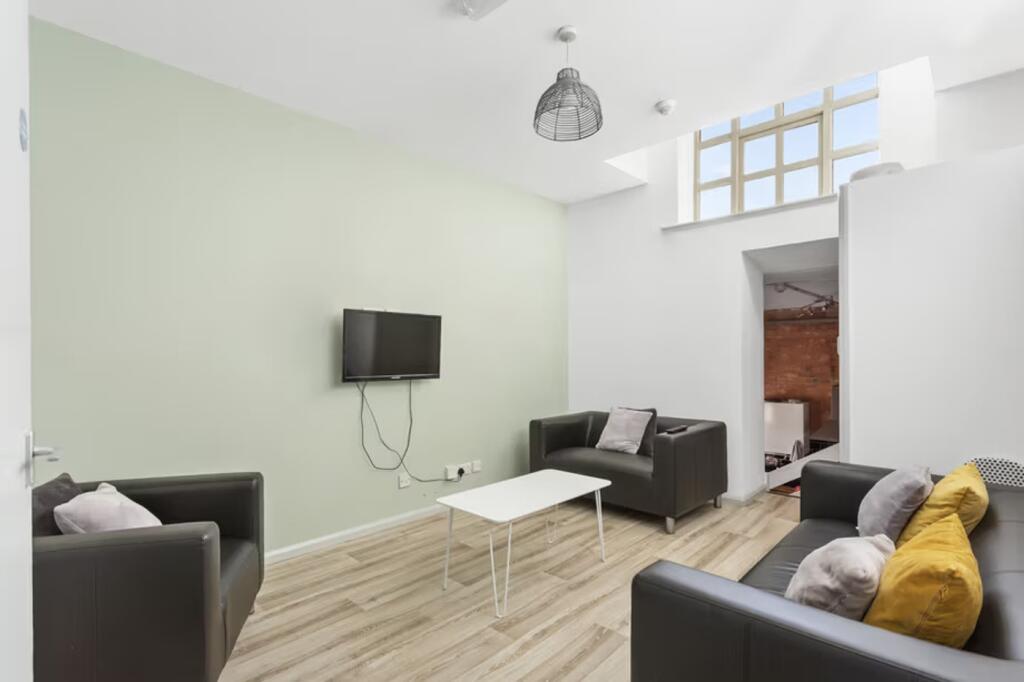 A spacious and bright modern living room with c...