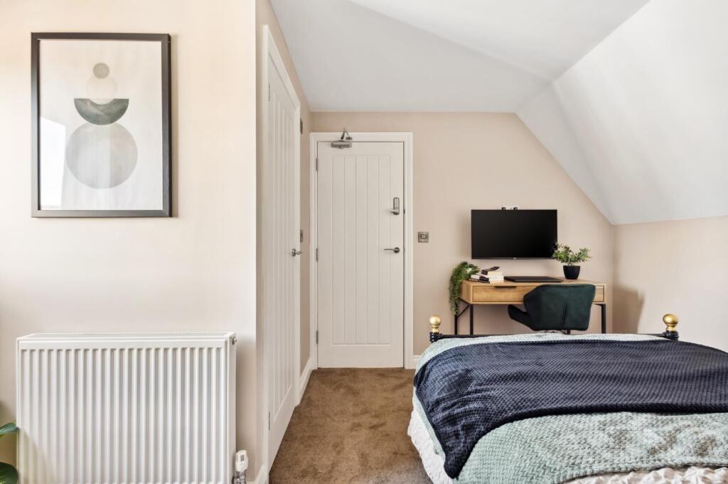 A beautifully designed double bedroom featuring...