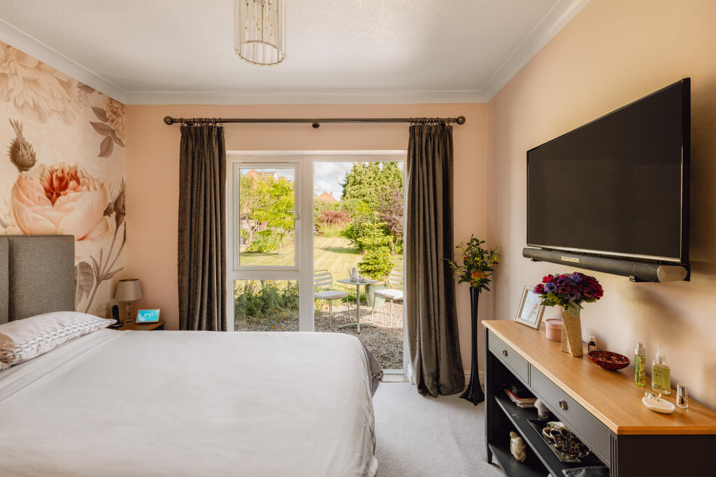 Principle suite leading to breakfast terrace through patio doors