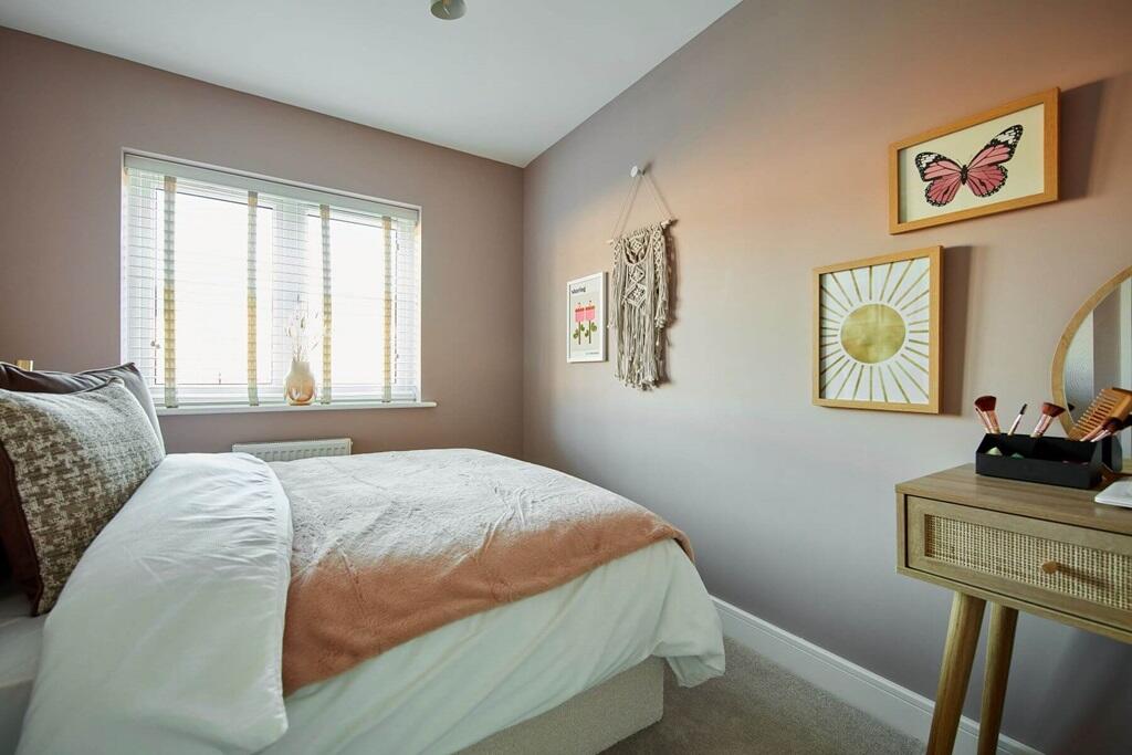 A third double bedroom overlooks the rear garden