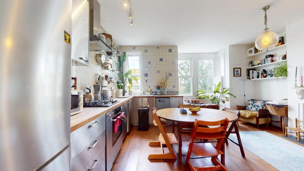 Bright and modern kitchen space featuring ample...