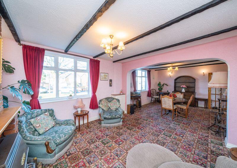 LOUNGE OPENS TO DINING ROOM