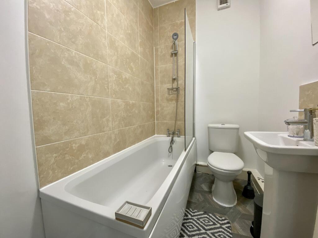 A bright and clean bathroom featuring a modern ...