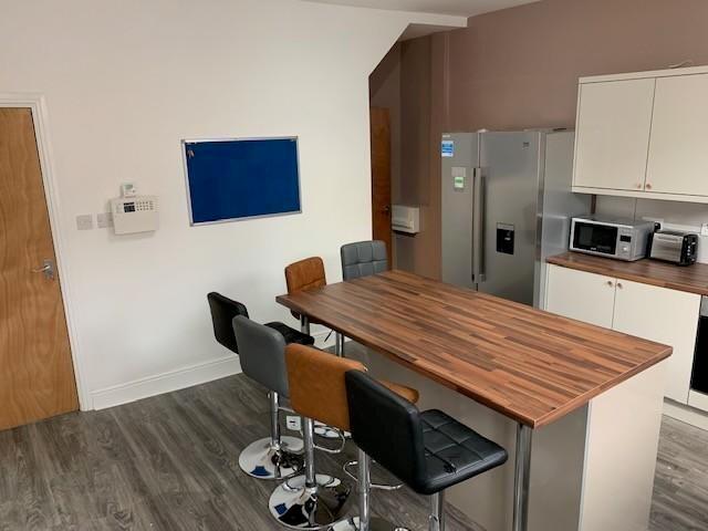 Bright and modern kitchen featuring a spacious ...