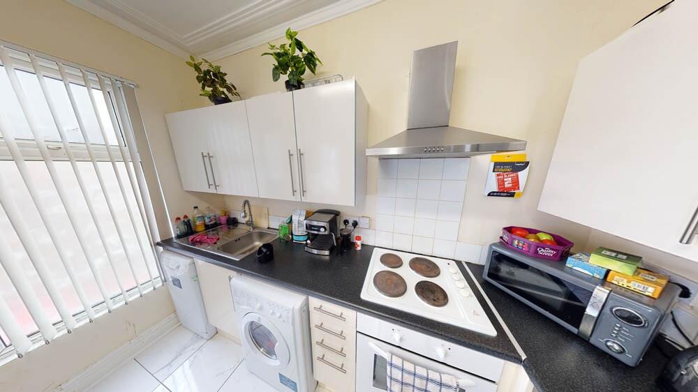 Bright and practical kitchen space featuring mo...