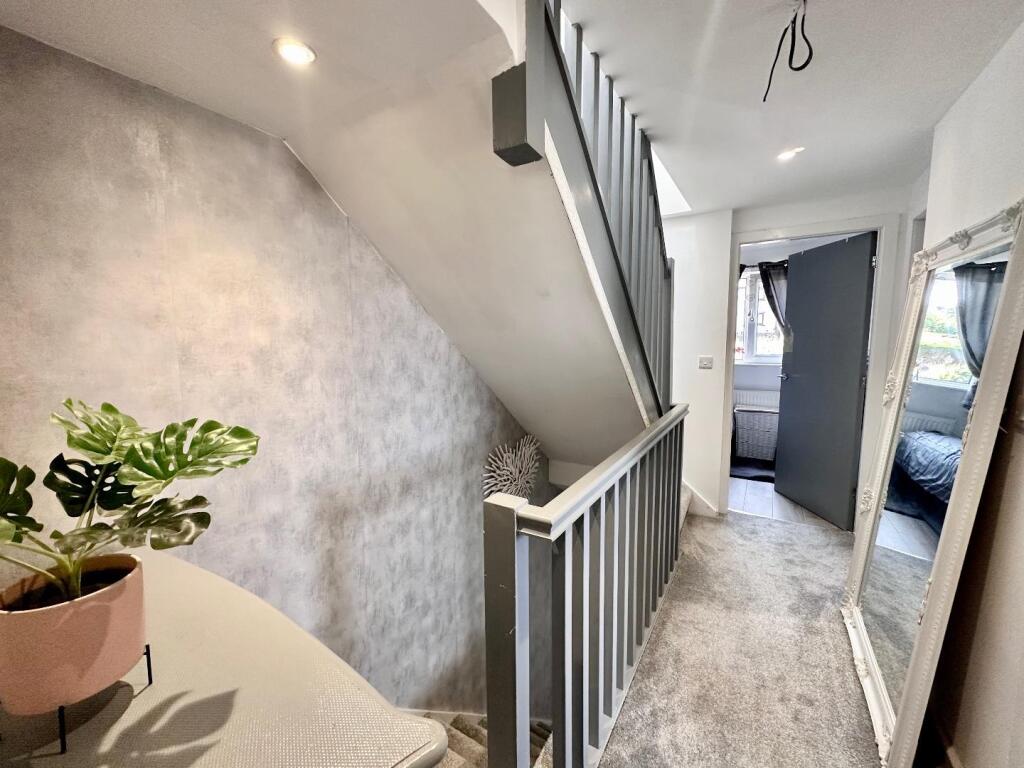TO THE FIRST FLOOR LANDING
