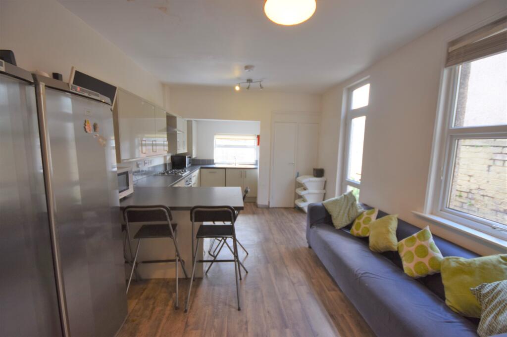 A spacious and well-lit kitchen area, perfect f...