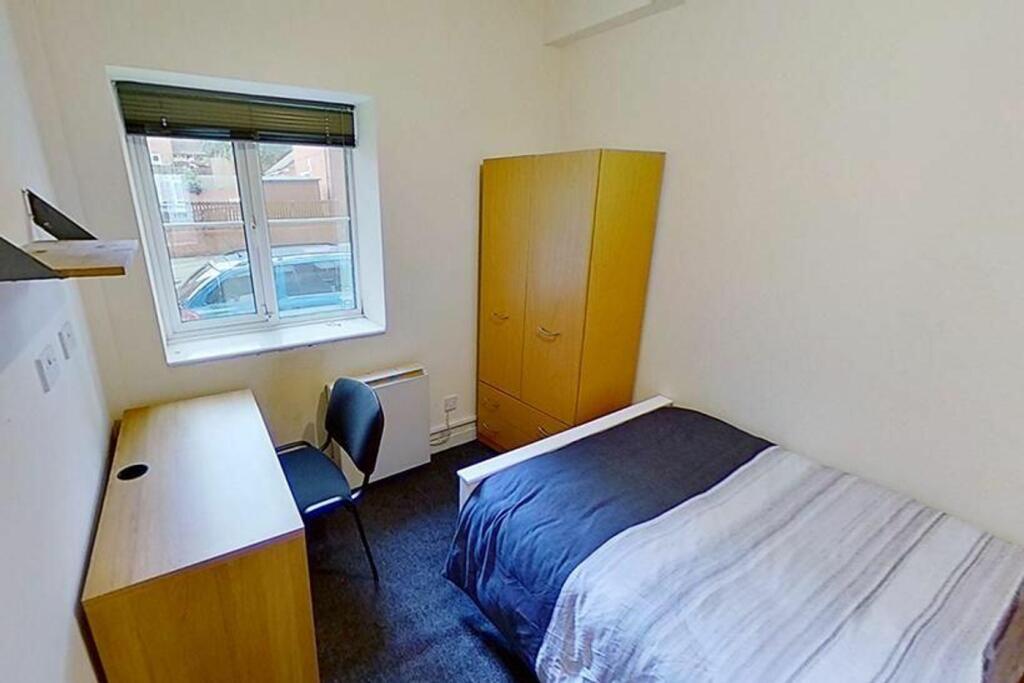 Cozy double bedroom featuring a comfortable bed...