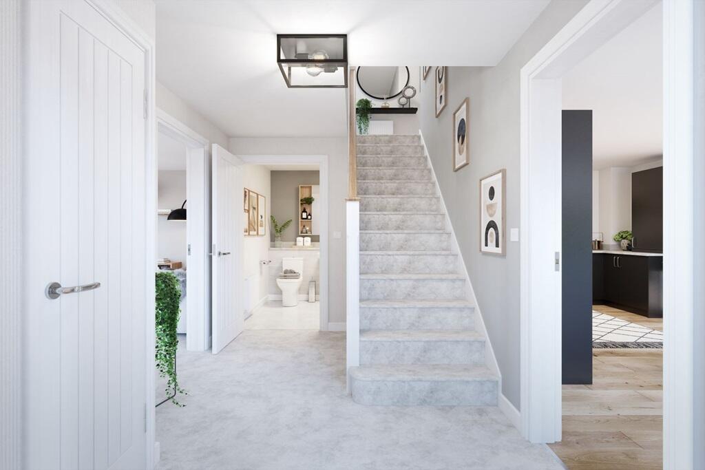 A welcoming hallway with a downstairs toilet and storage space