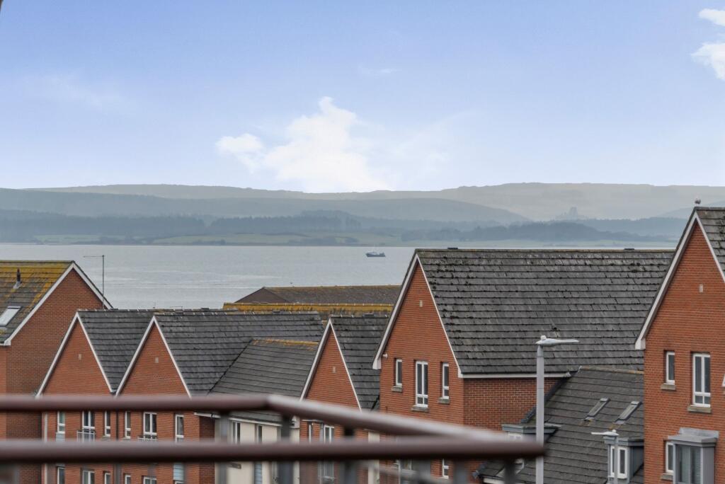 Open plan living space with balcony