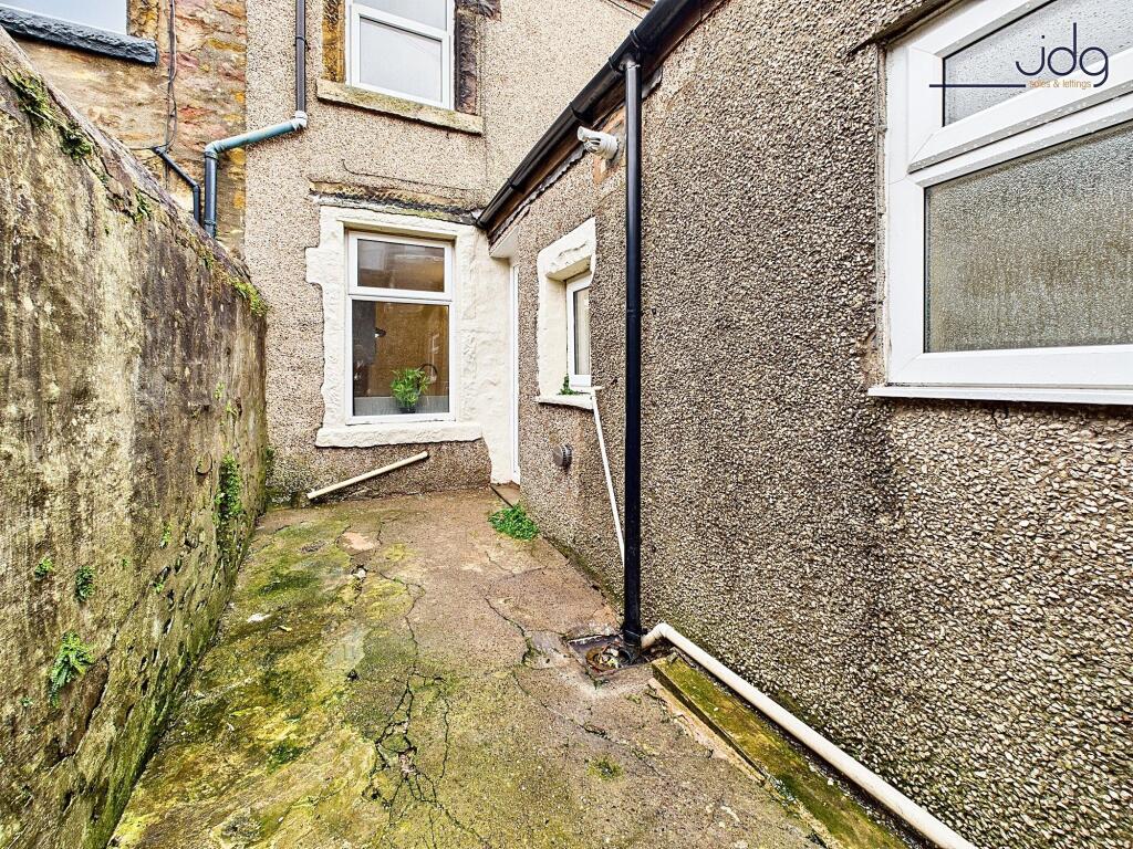 Yard, with rear view of the property