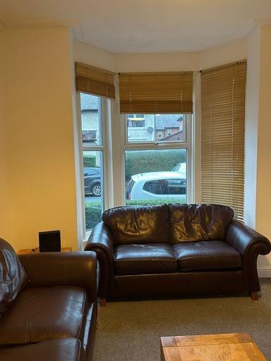 A welcoming and well-maintained living room fea...