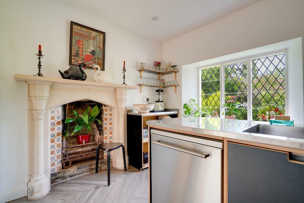 Kitchen with grand fire place