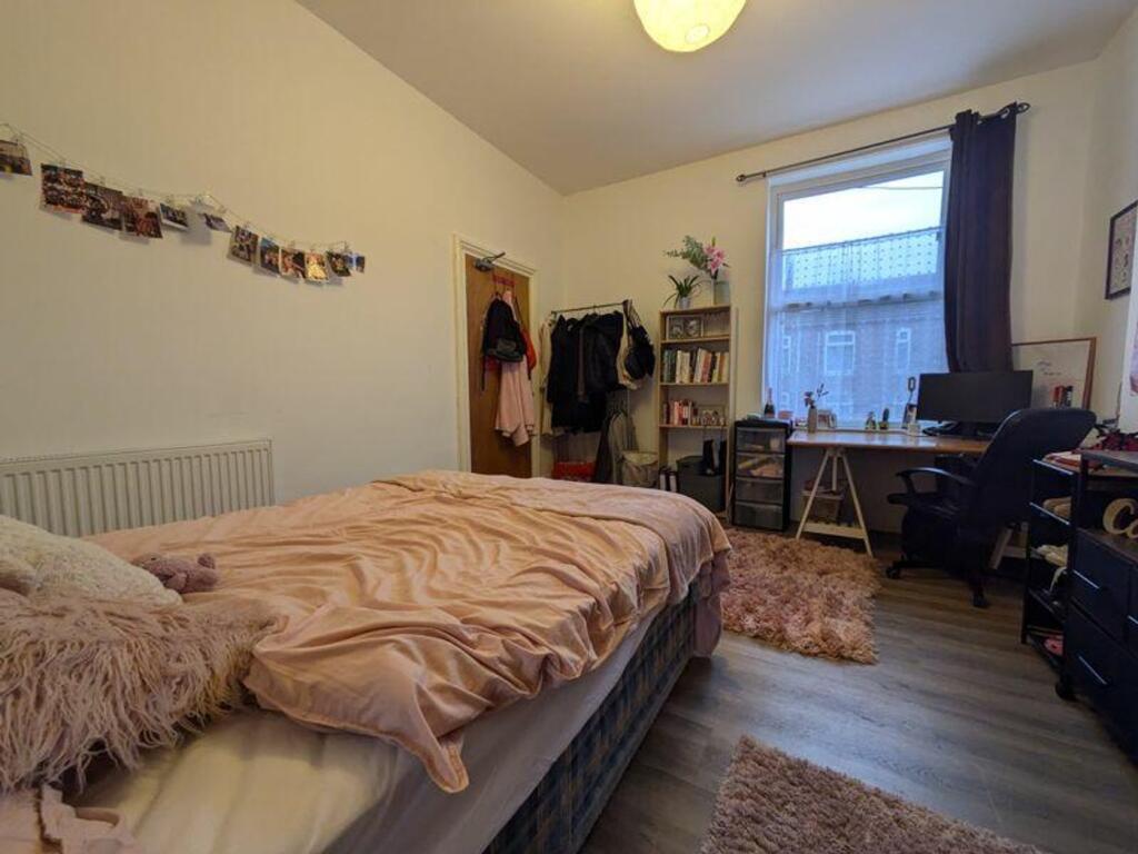A cozy and inviting double bedroom with natural...