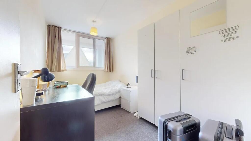 Bright and neat single bedroom featuring a stud...