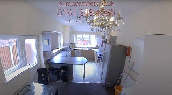 Bright, functional kitchen with a central break...