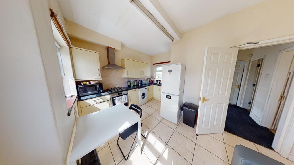 Bright and tidy kitchen with modern appliances ...