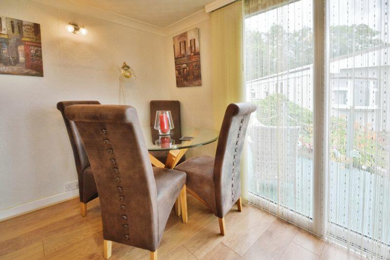 Dining area with patio doors to raise...