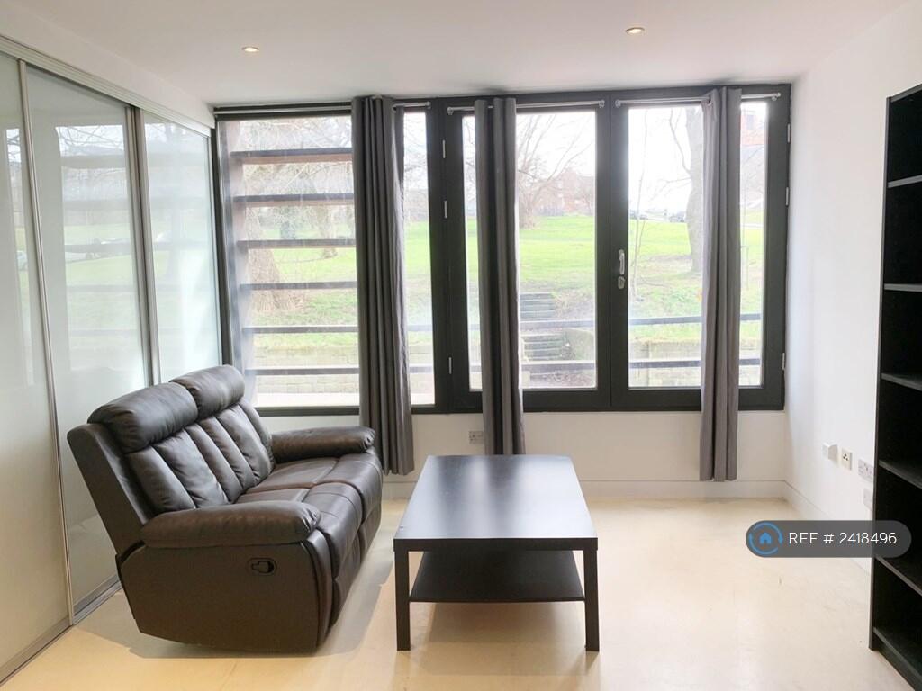 Living Room With Scenic Green Park Views